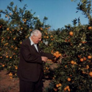 Jack Davies picking oranges in California