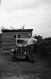Jack Davies with “Old Faithful,” his pre-war Morris Minor, c.1949.
