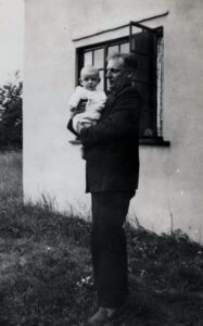 Jack holding his son Alfred - 1938 at their home Elm Grove, Normandy